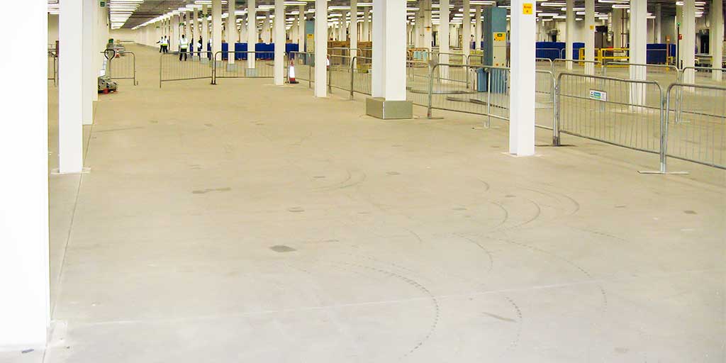 Ground bearing concrete floor in a large empty industrial unit