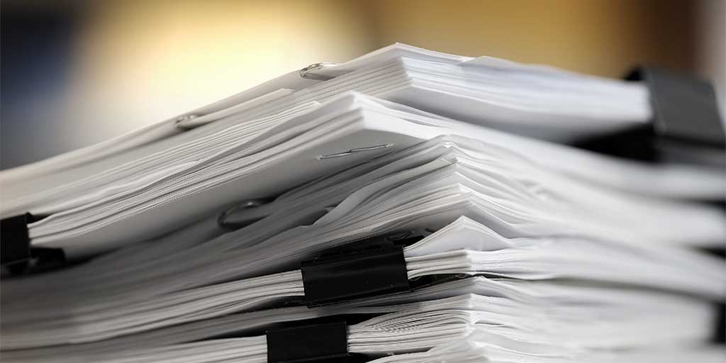 Pile of contract documents