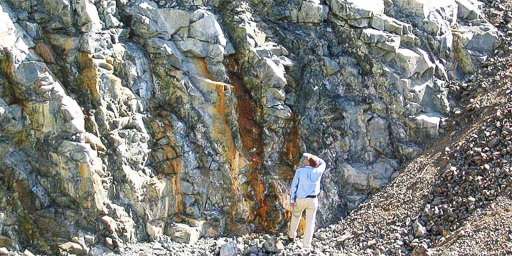 Geology Consultant looking at geological strata for possible source of building stone