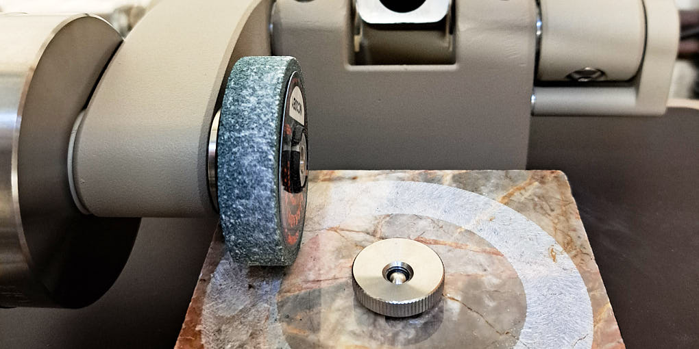 Taber abrasion stone testing in the laboratory